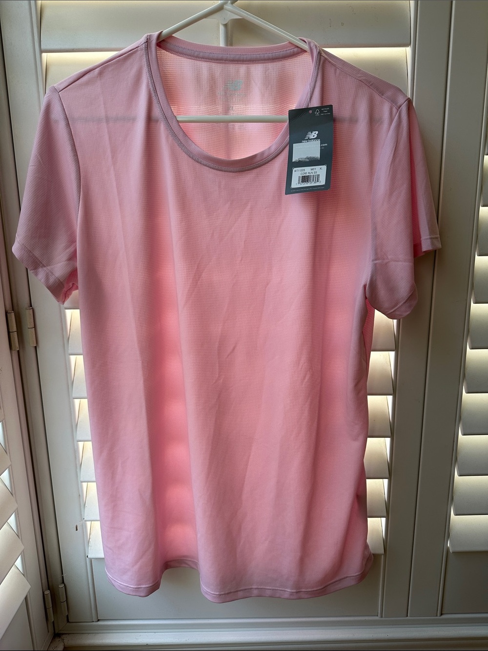 NWT XL women’s New Balance short sleeve pink top.